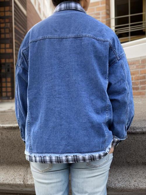 a person in a blue jean jacket standing on steps