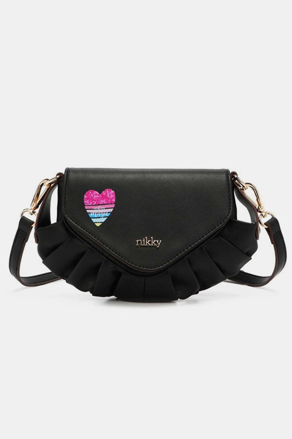 a black purse with a heart on it