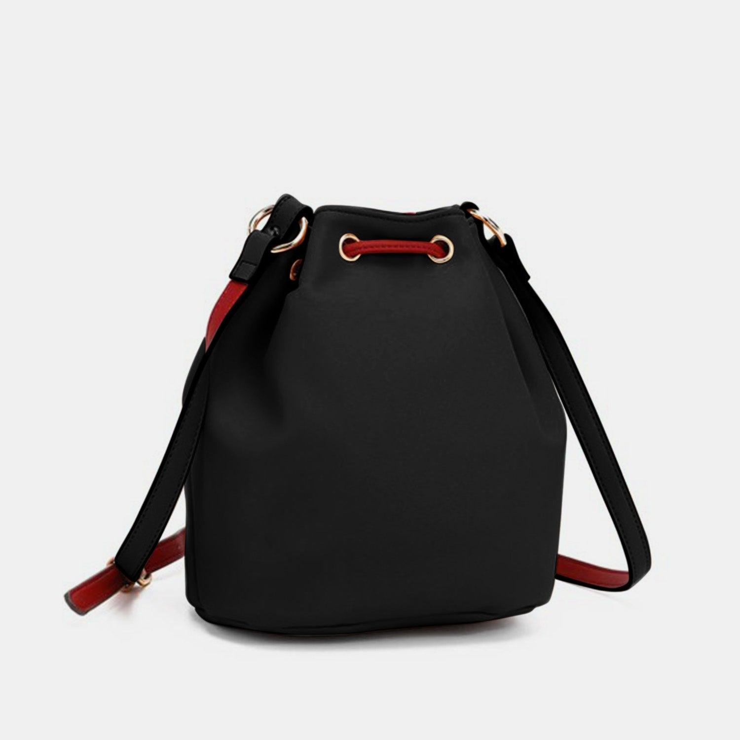 a black bag with a red handle