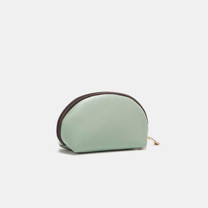 a small mint green purse with a brown trim