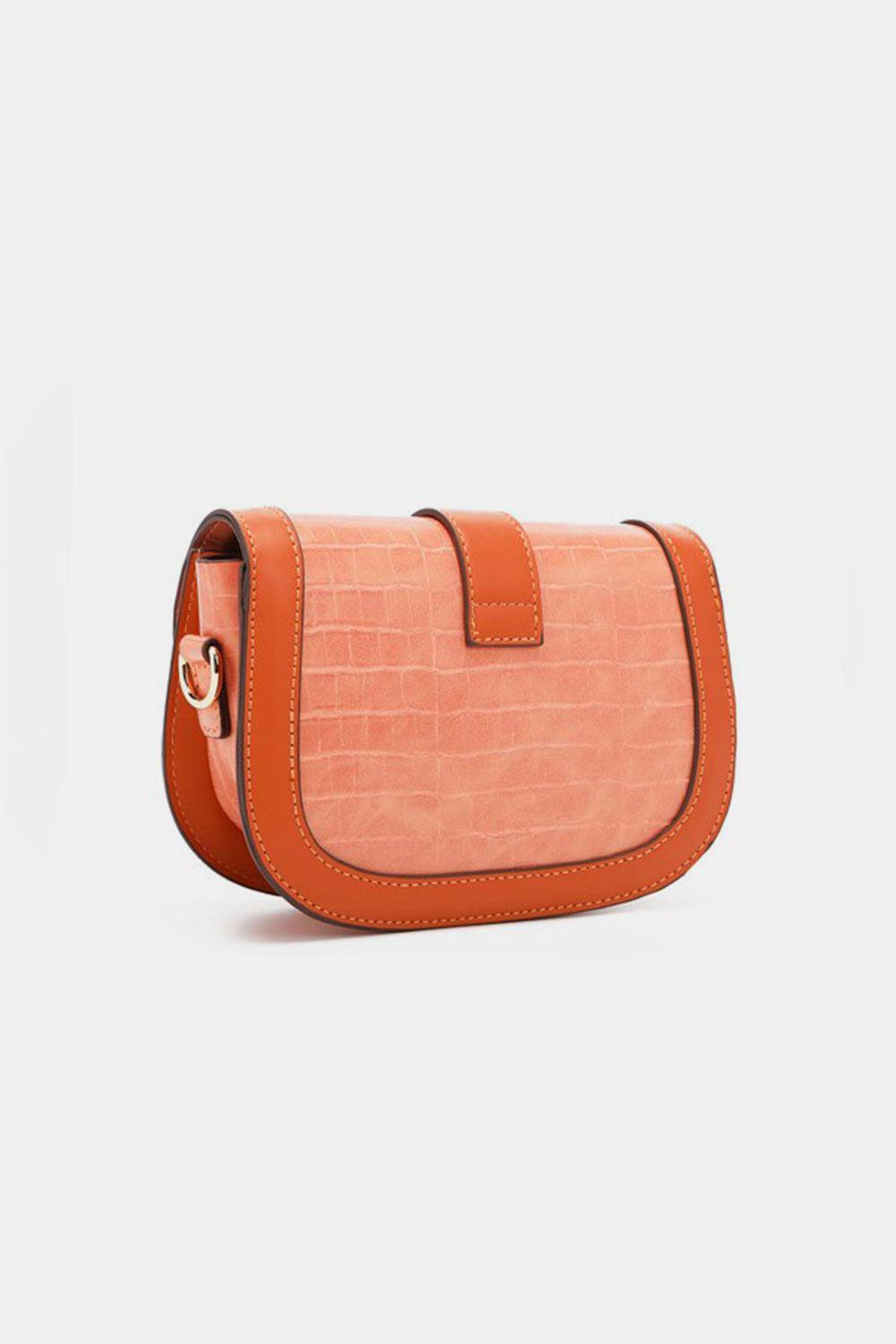 a small orange purse on a white background