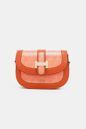 a small orange purse on a white background