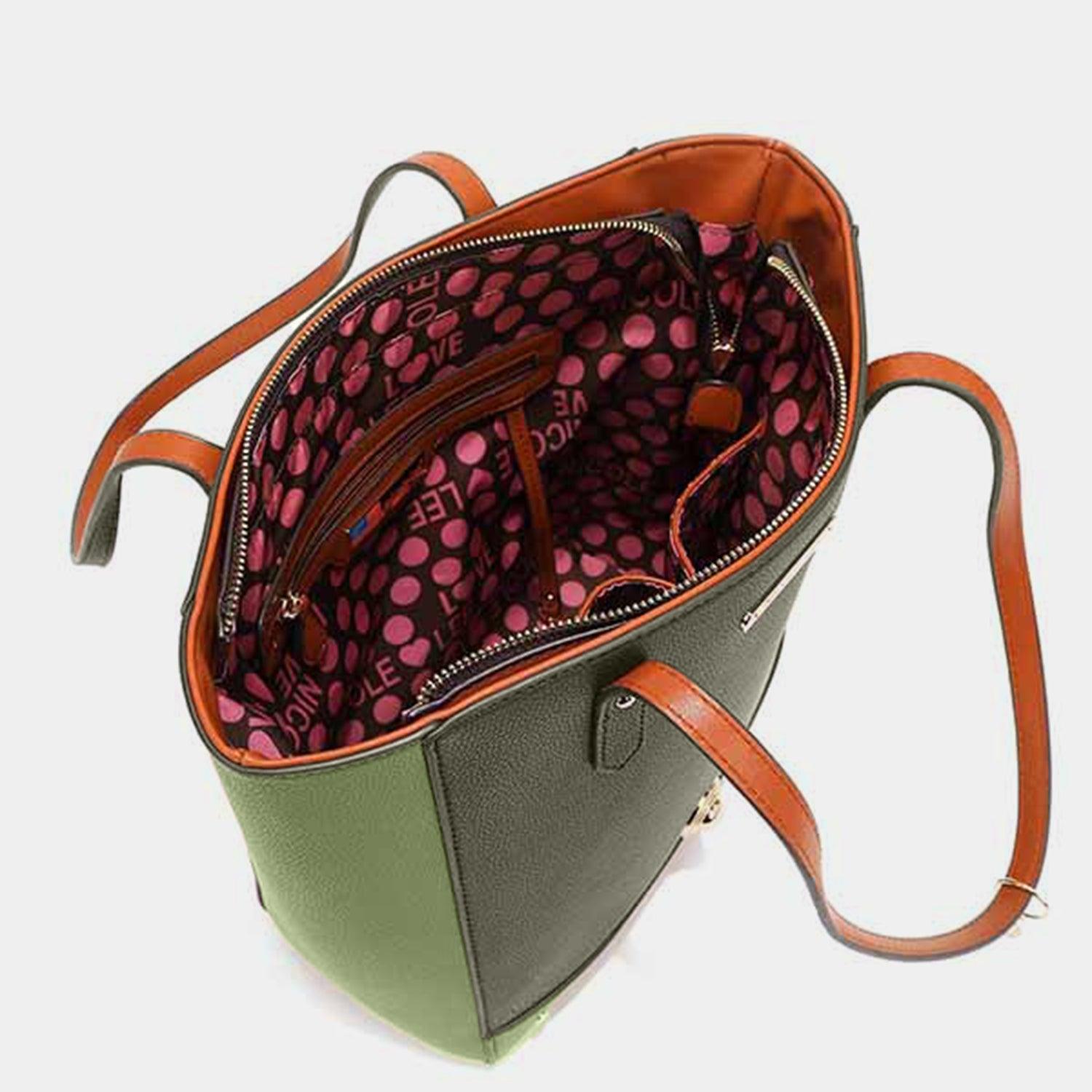 a green and pink purse on a white background