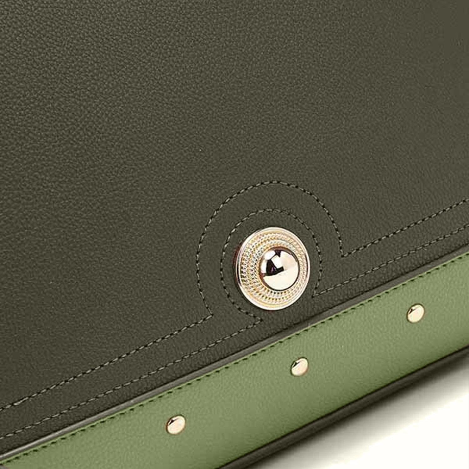 a close up of a green purse on a white surface