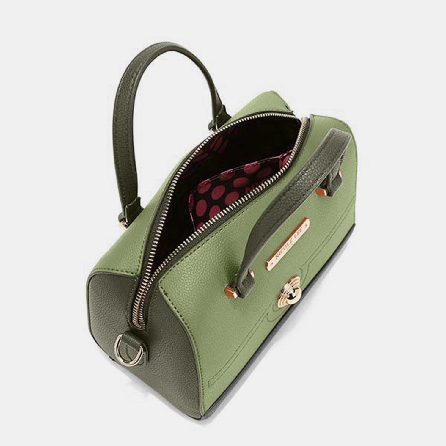 a green handbag with a red polka dot lining
