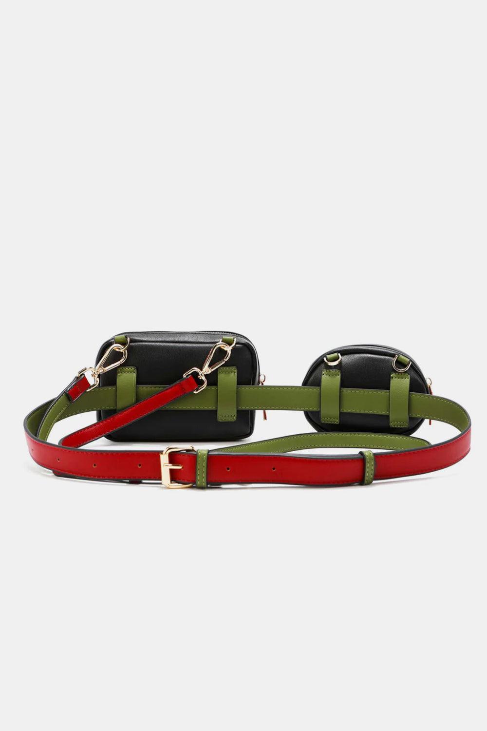 a black, green and red belted bag on a white background