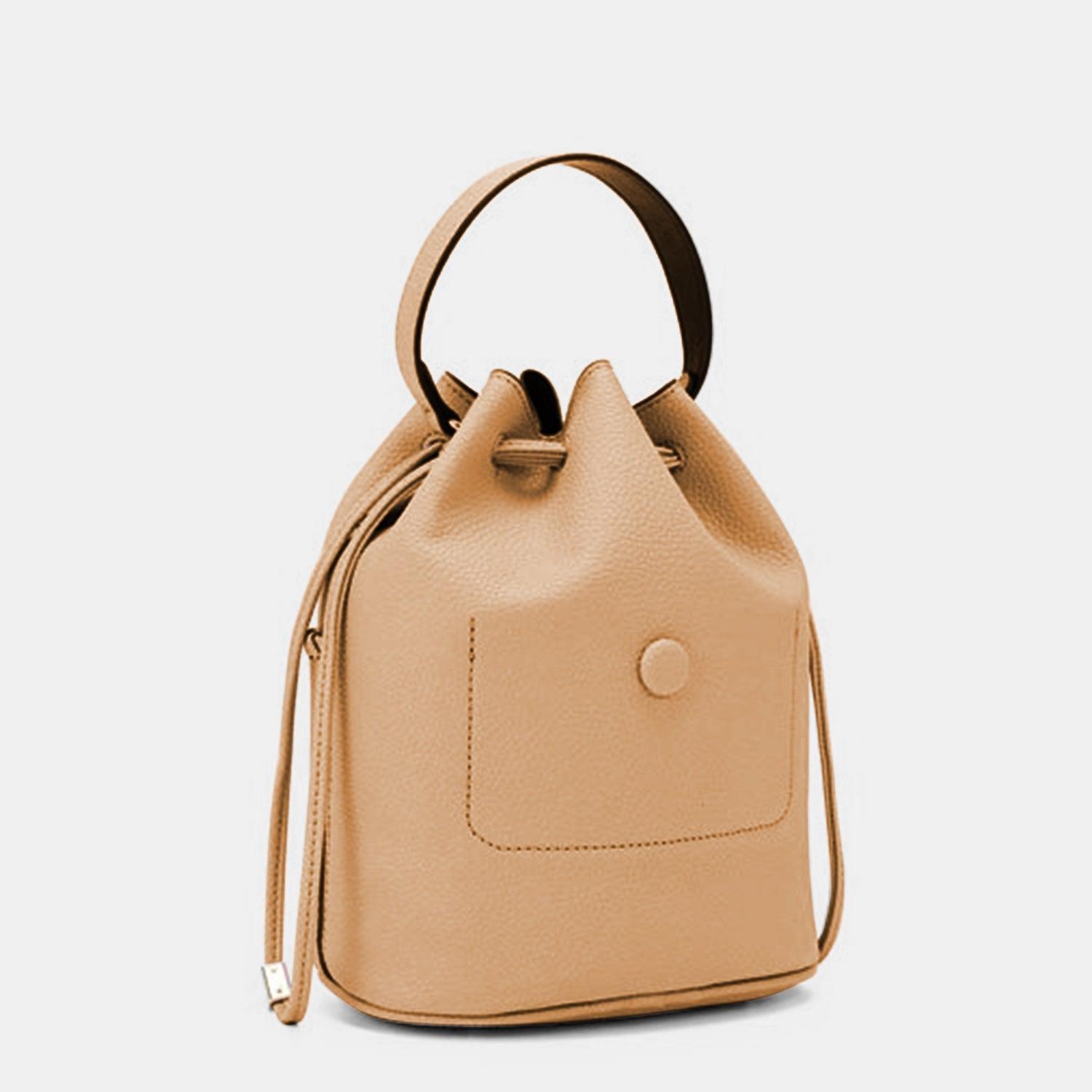 a tan leather handbag on a white background