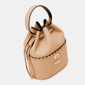 a small tan purse with a handle on a white background