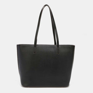 a black leather tote bag on a white background