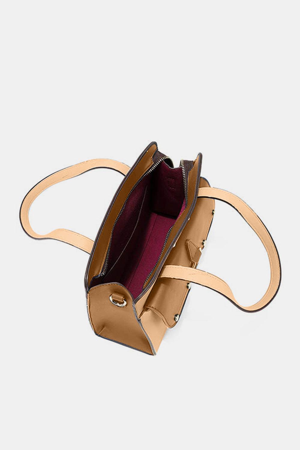 a handbag is shown with a strap around it