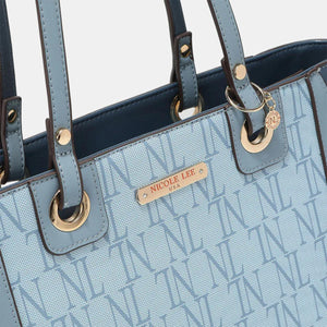 a blue handbag with a name tag on it