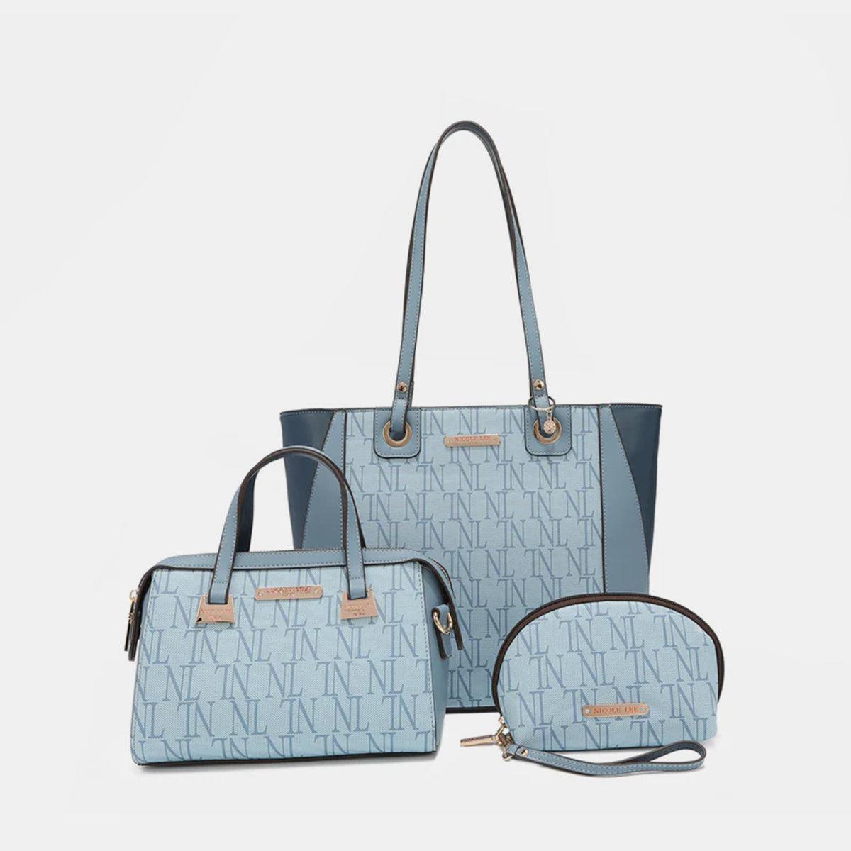 a set of three handbags and a purse