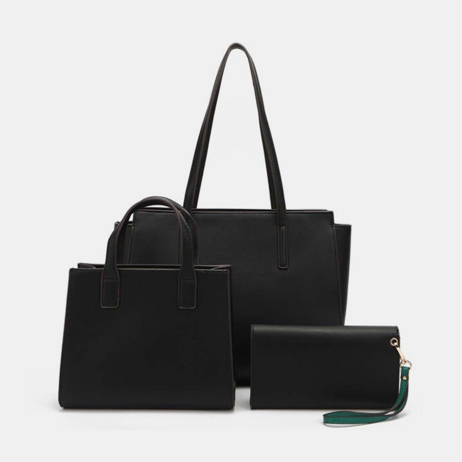 a black handbag and wallet sitting next to each other