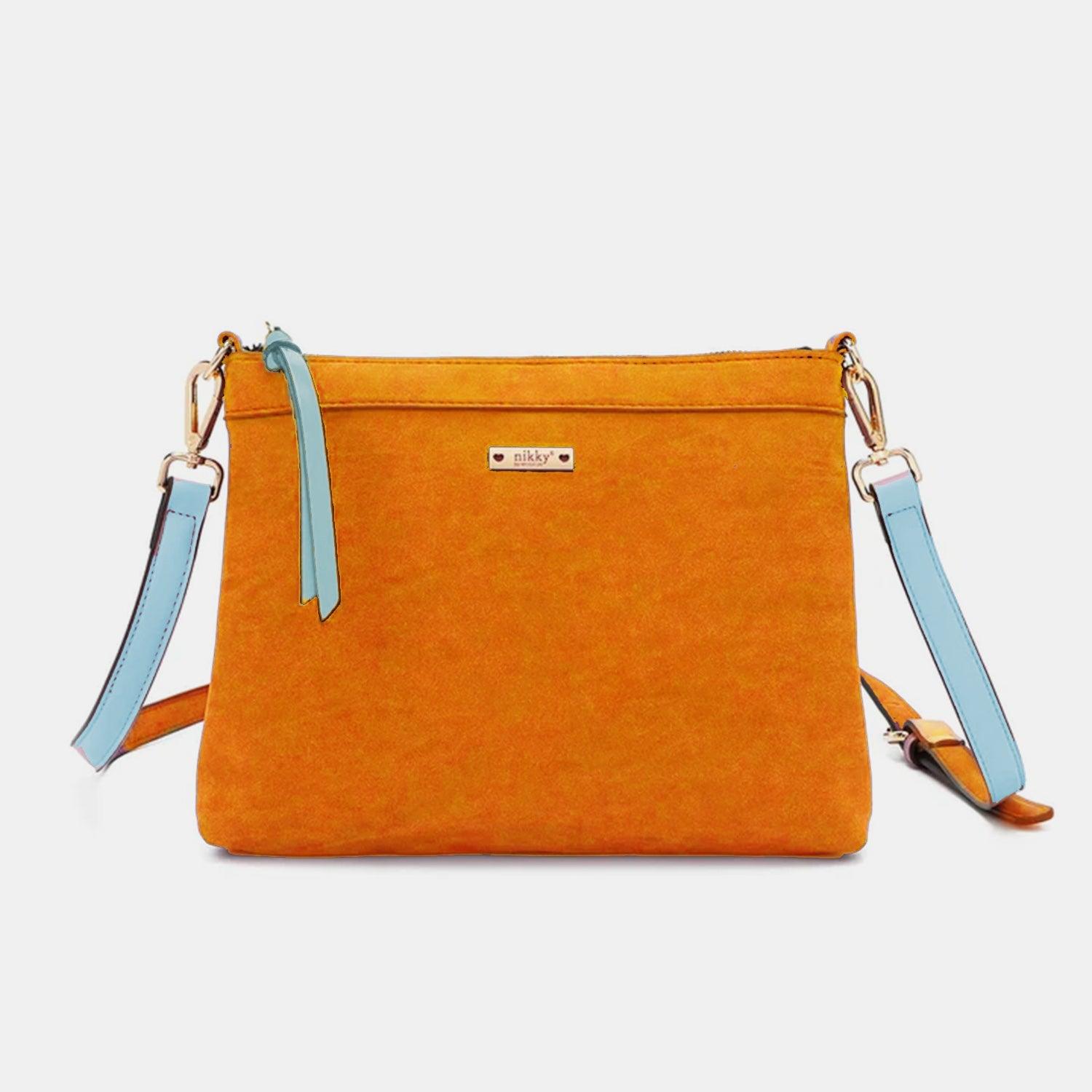 a small orange purse with a blue strap