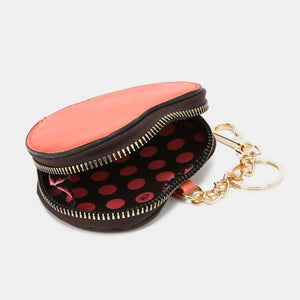 a coin purse with a keychain attached to it