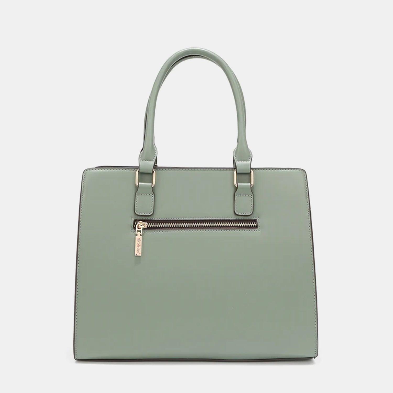 a green handbag with a zipper on the front