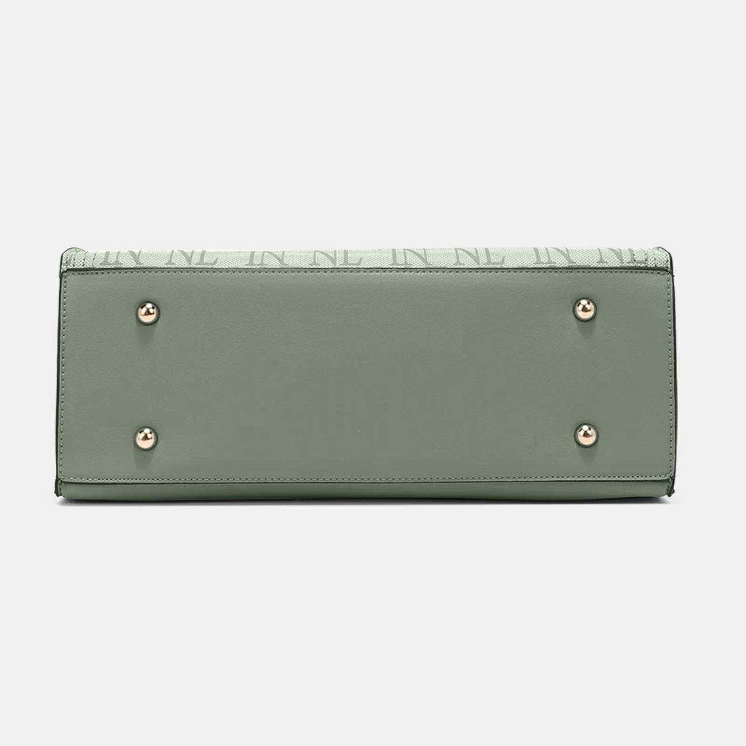 a women's wallet with studded details on the front