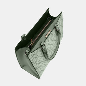 a green handbag with a zipper on it
