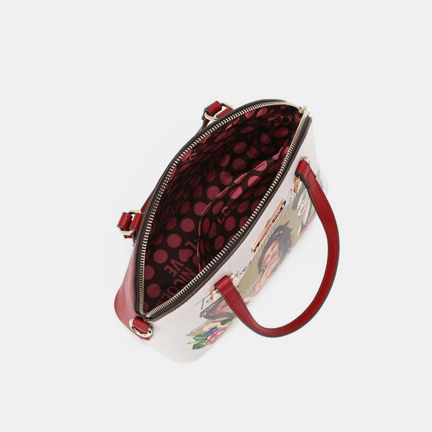 a small white purse with a red handle