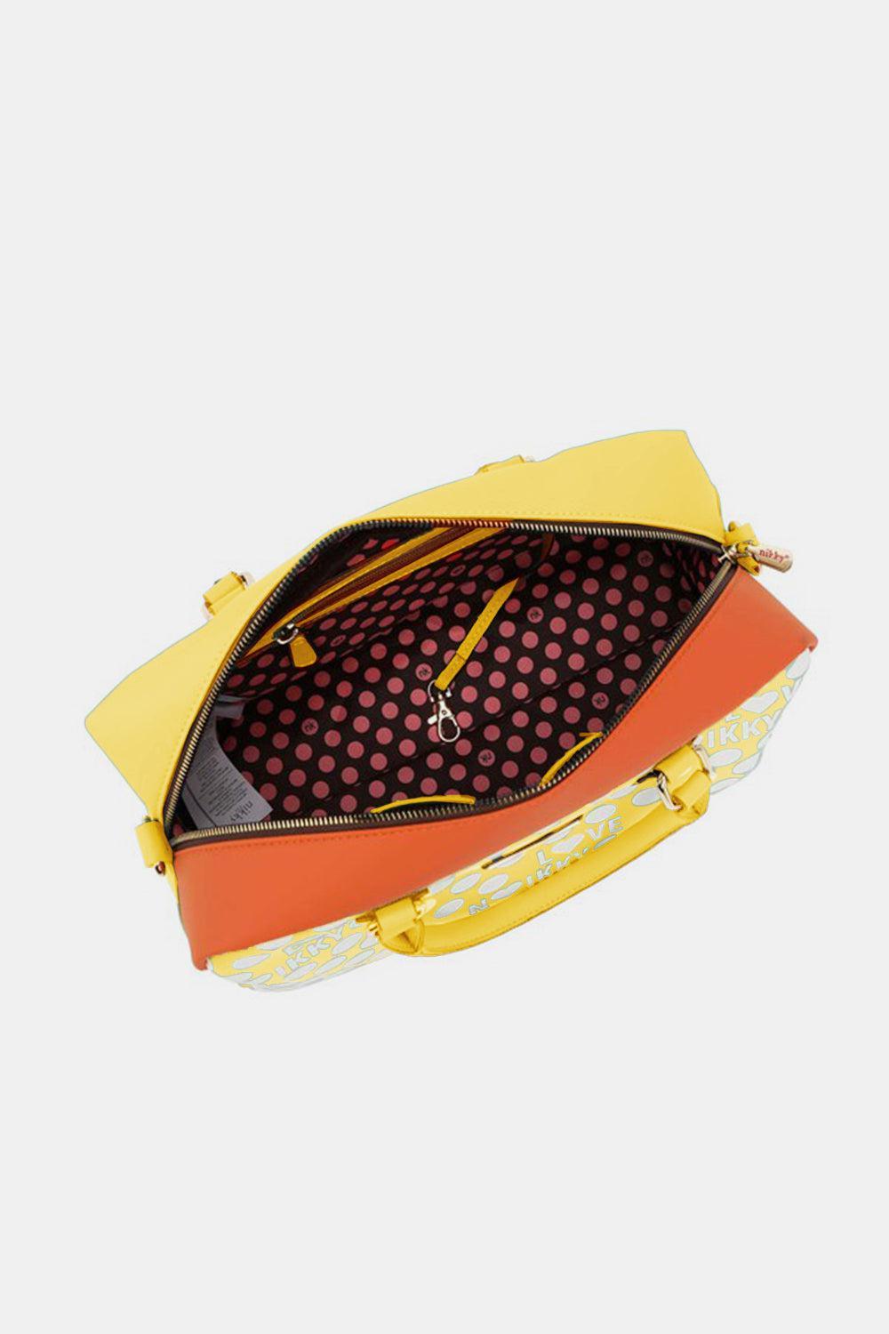a yellow and red handbag with a polka dot pattern