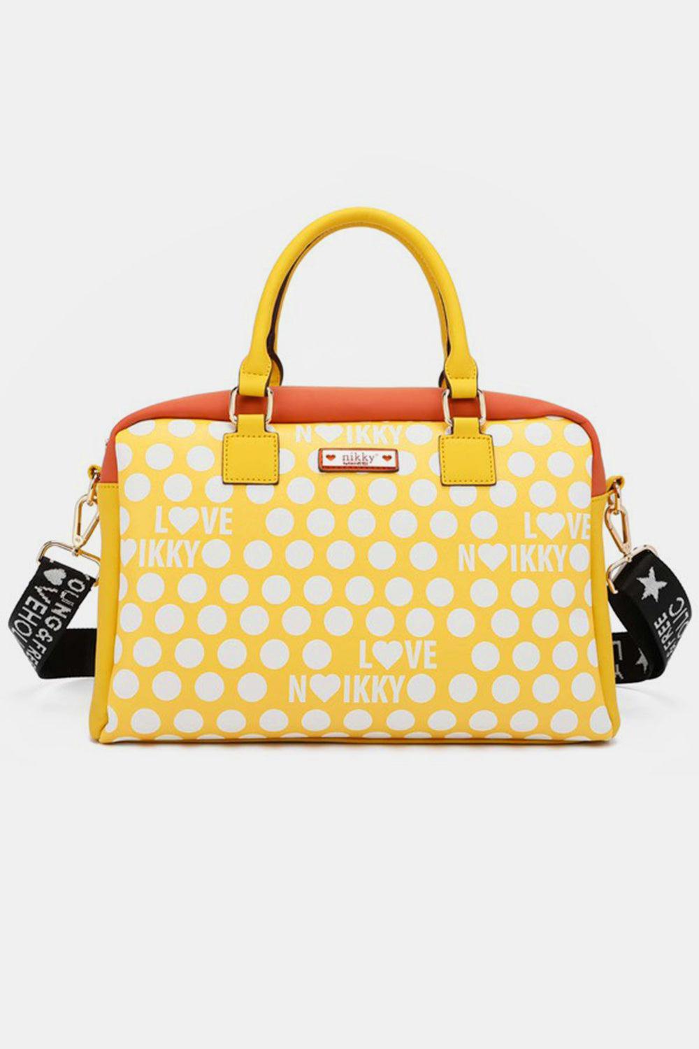 a yellow and white polka dot purse