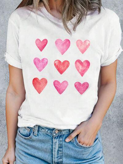 a woman wearing a t - shirt with hearts painted on it