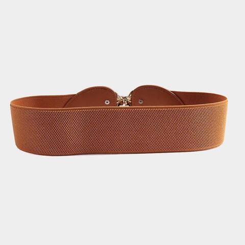 a brown belt with a gold buckle on it