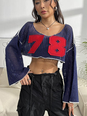 a woman wearing a crop top with a number on it