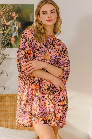 a woman standing in a room with her arms crossed