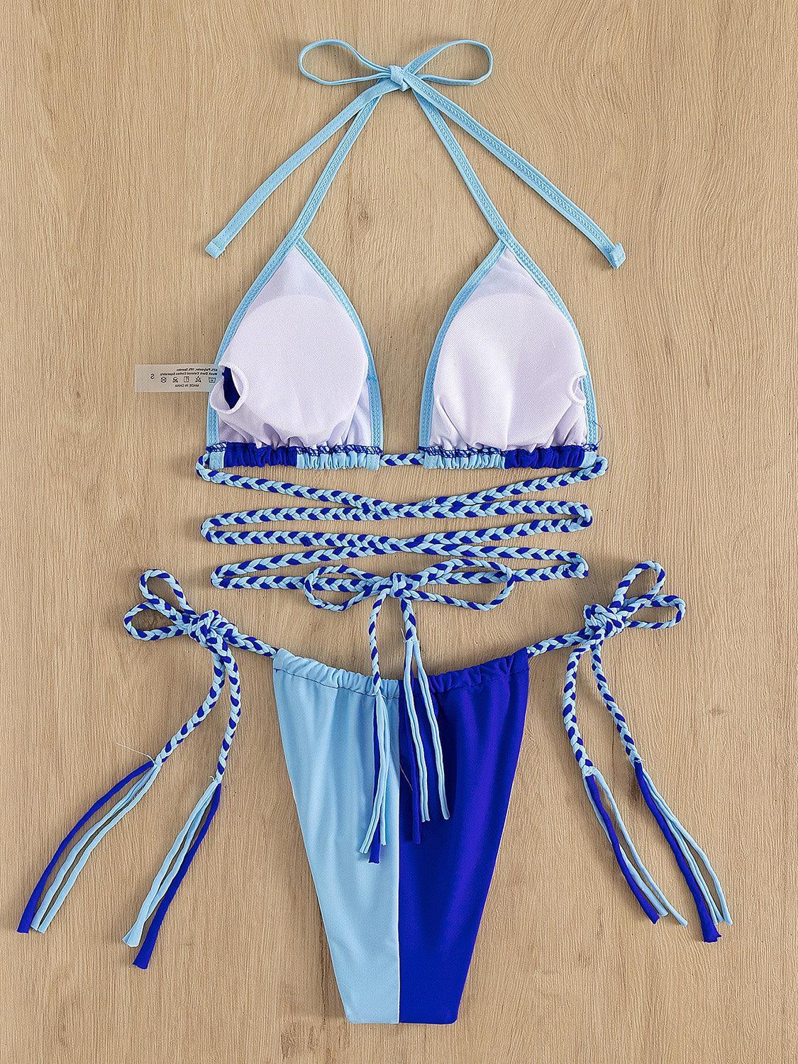 a blue and white bikini with a tie around it