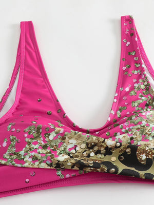 a pink bra with gold sequins on it