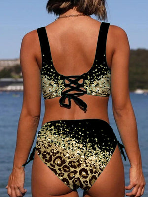 a woman in a leopard print bikini top and bottom