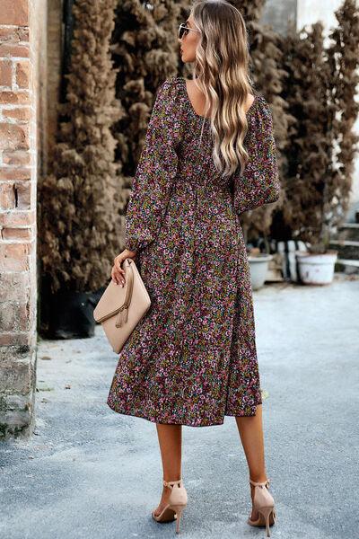 a woman in a floral print dress