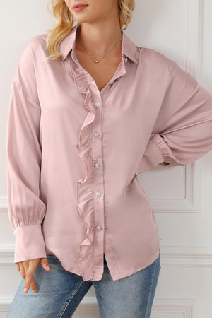 a woman wearing a pink shirt and jeans