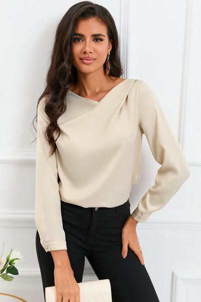 a woman in black pants and a white blouse