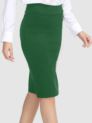 a woman in a white shirt and green skirt