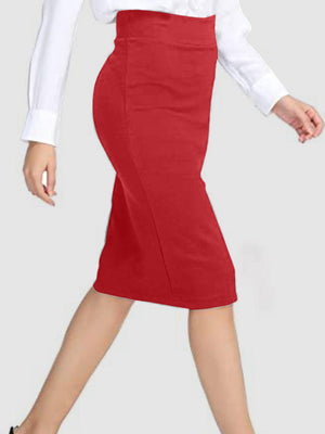 a woman in a white shirt and red skirt