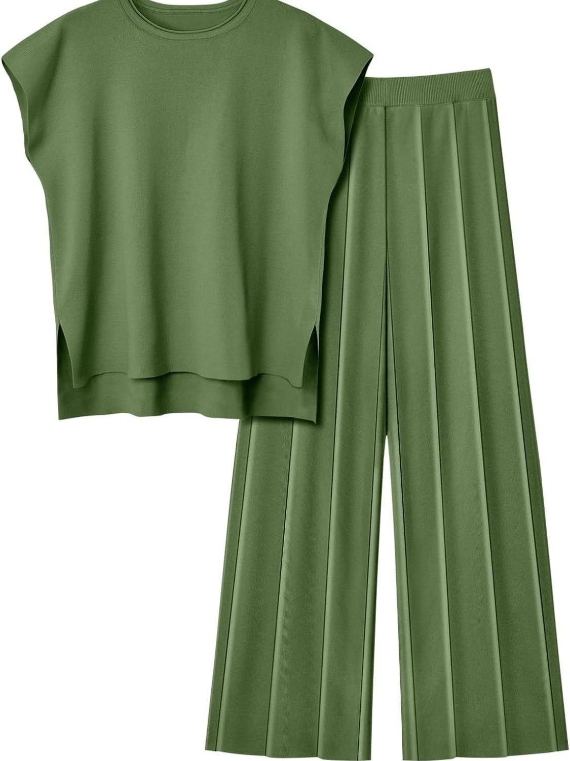 a green crop top and pleated pants