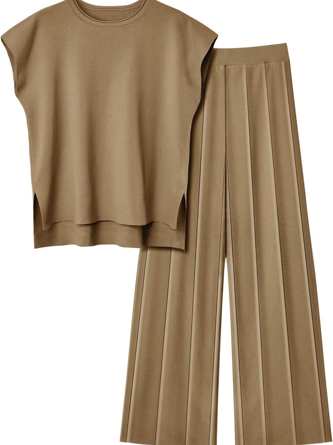 a woman wearing a tan top and pleated pants