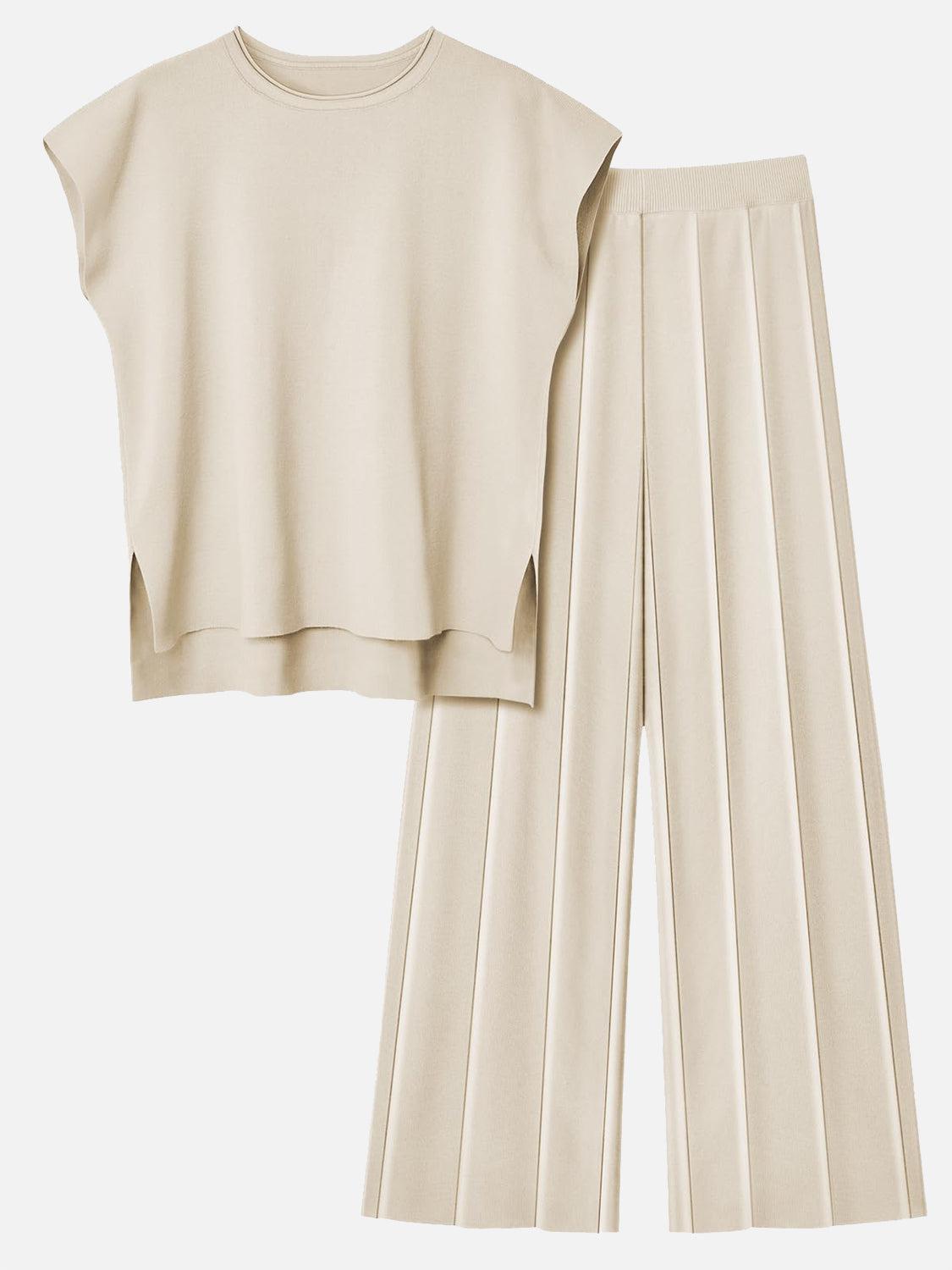 a cropped top and pleated pants are shown