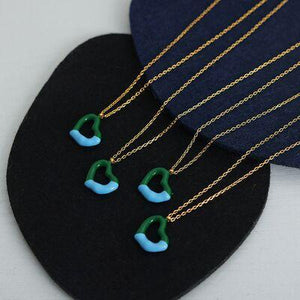 a pair of necklaces with green and blue beads