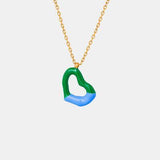 a necklace with a green and blue heart on it