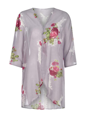 a women's blouse with flowers on it