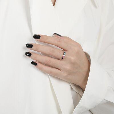 a woman wearing a white shirt and black nails