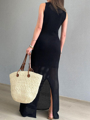 a woman in a black dress holding a straw bag