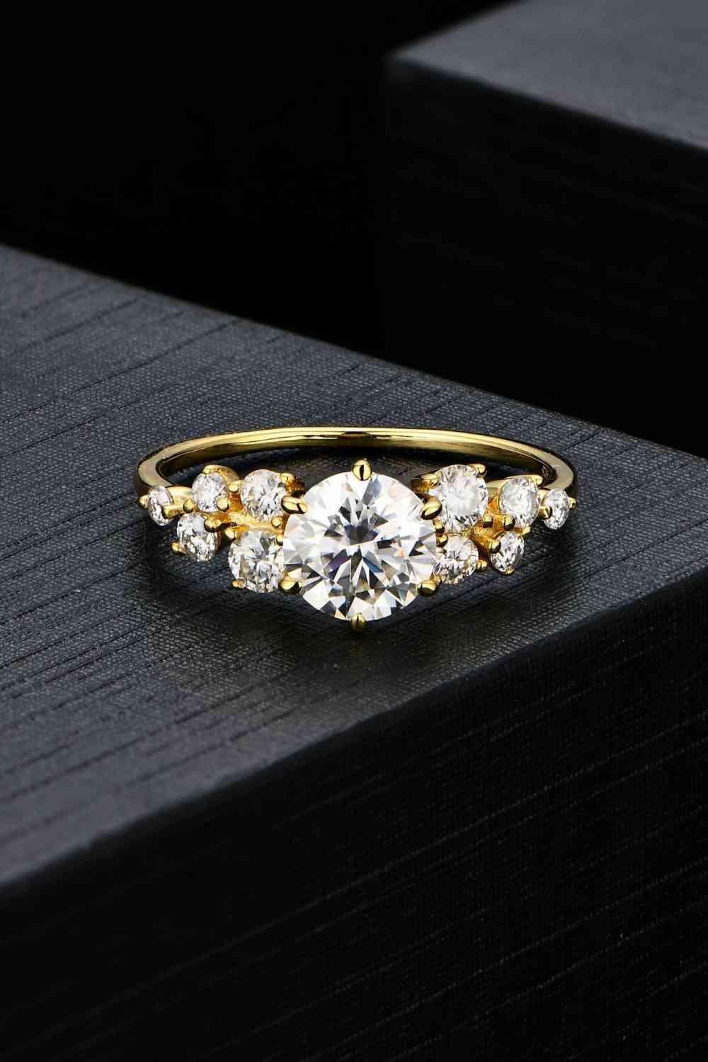 a gold ring with three stones on top of it