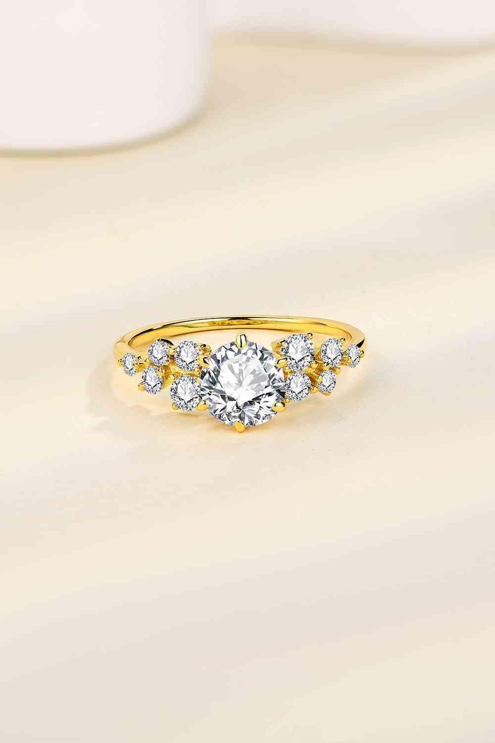 a yellow gold ring with a diamond set in the middle