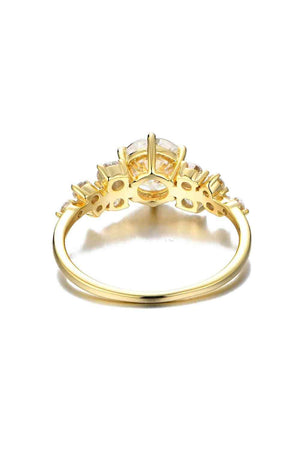 a yellow gold ring with a cluster of diamonds