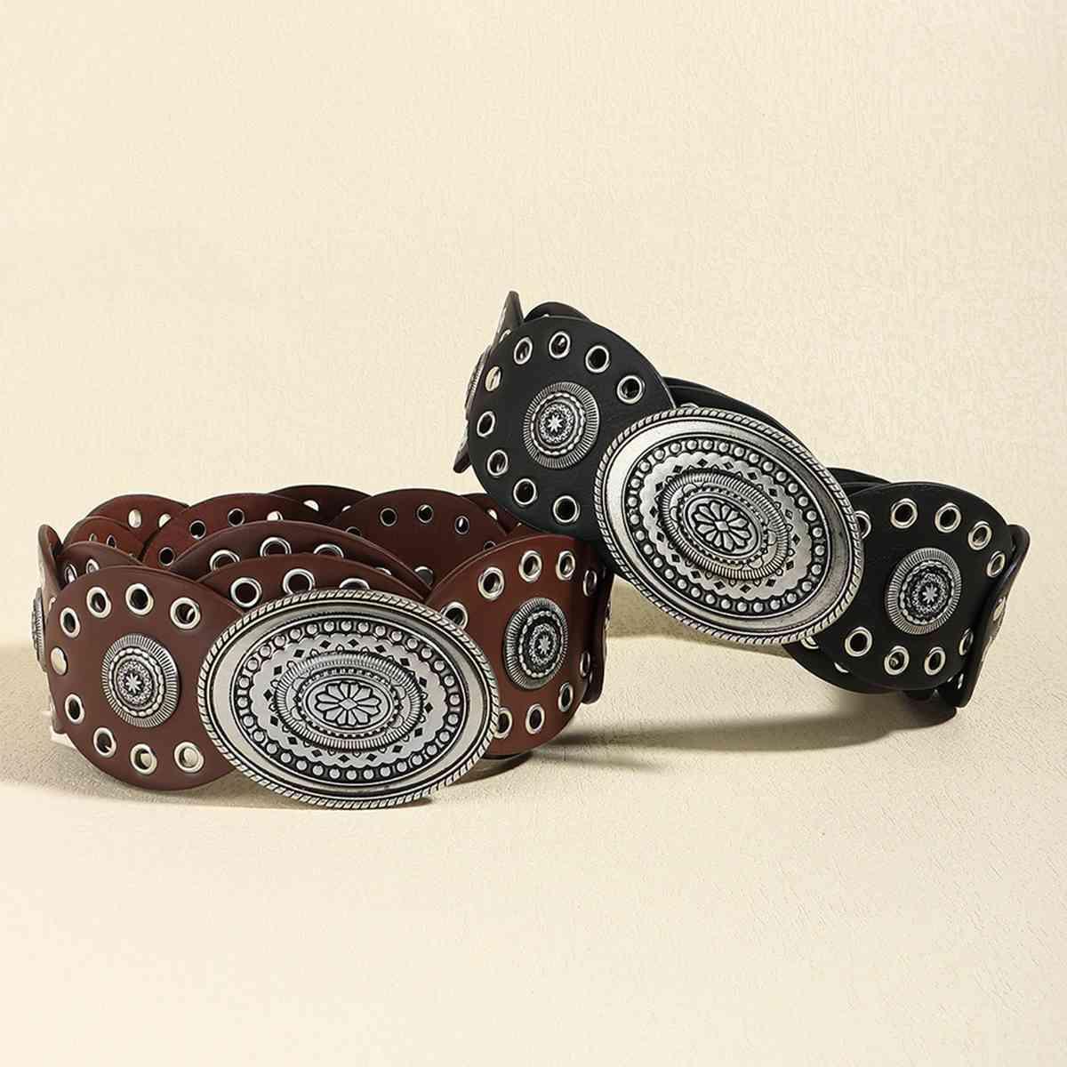 a pair of black and white patterned leather bracelets