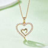 a diamond heart pendant on a chain
